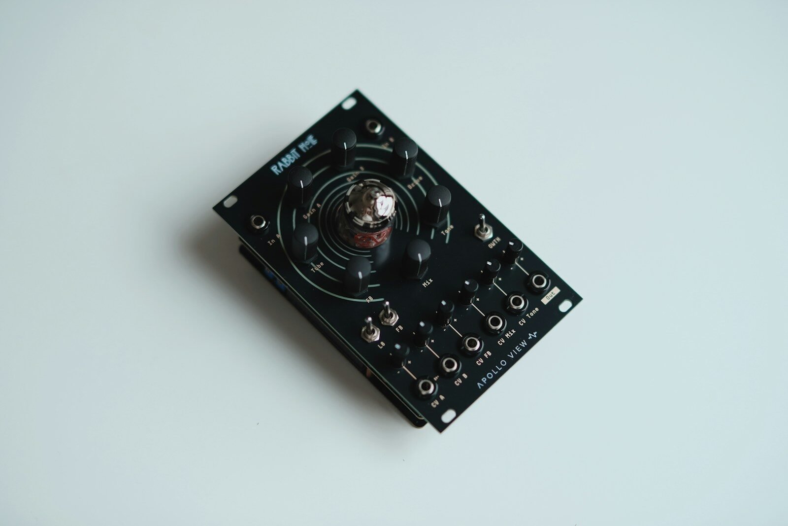 Black electronic device with a central glass tube