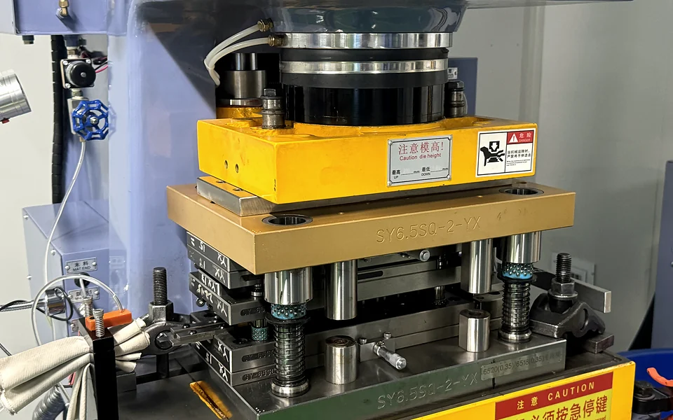 Precision stamping tooling for custom automotive snap dome geometry