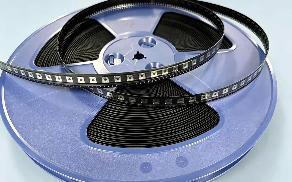 Tape-and-reel snap dome packaging for automated placement