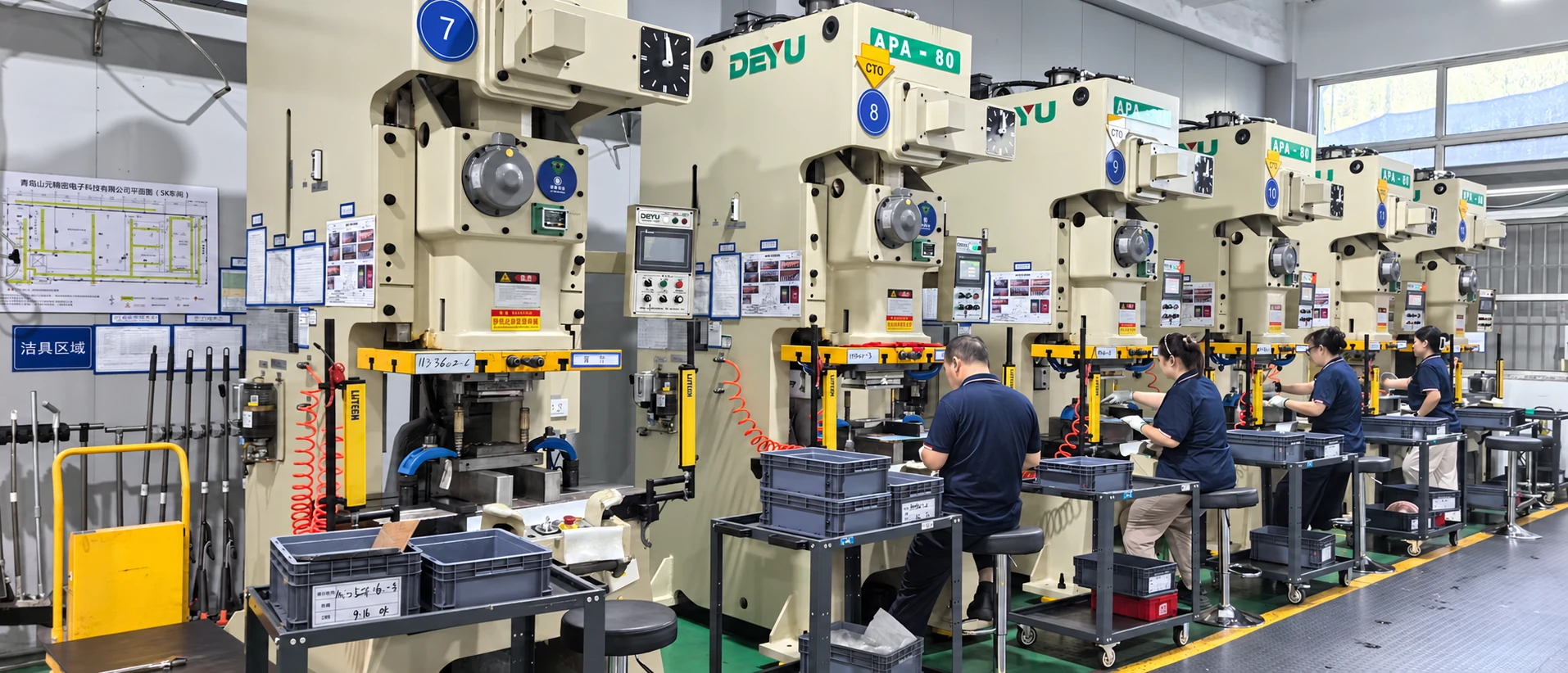 Precision metal stamping production line with operators at Shanyo